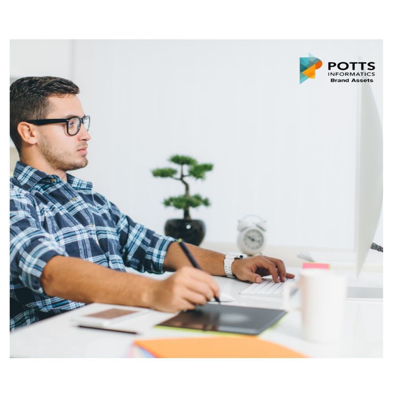 Office worker at desk symbolizing working smarter