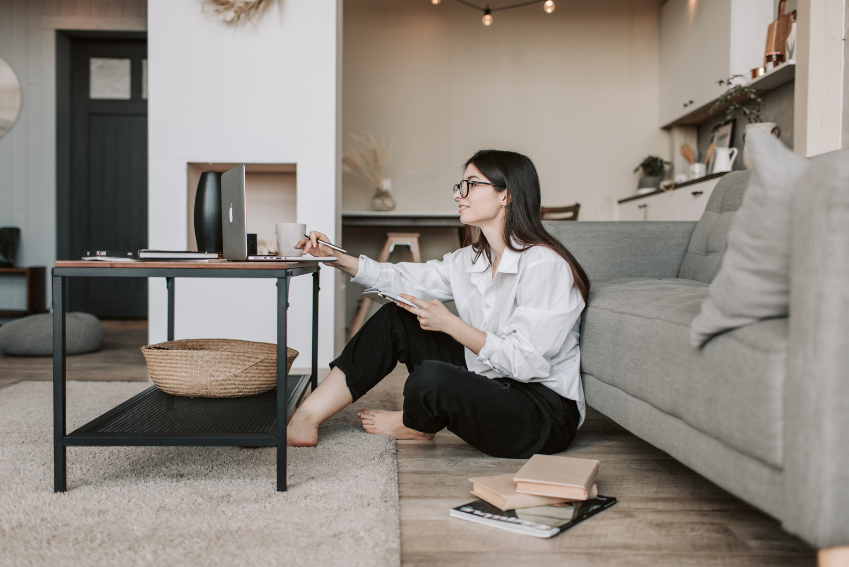 Working happily by a woman sitting